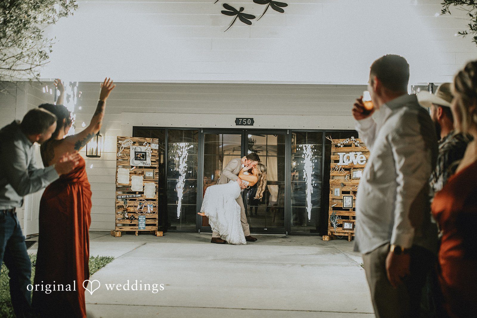 Catalyna + Nik Newlyweds being sent off with fireworks at the end of the wedding day