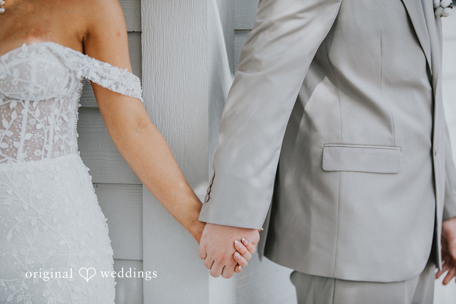 Catalyna + Nik Bride and groom holding hands together