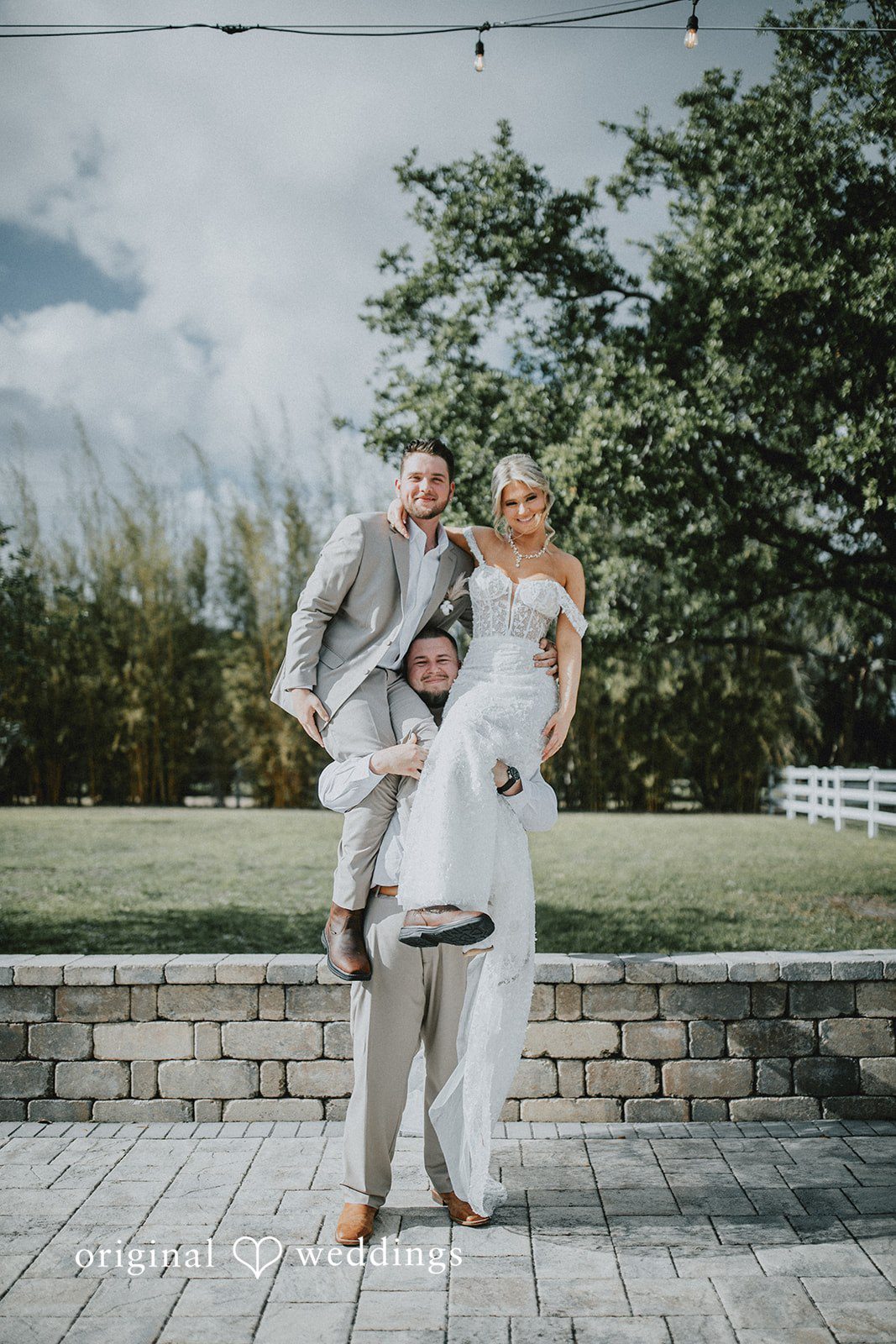 Catalyna + Nik Bride and groom sharing a fun moment with a close friend