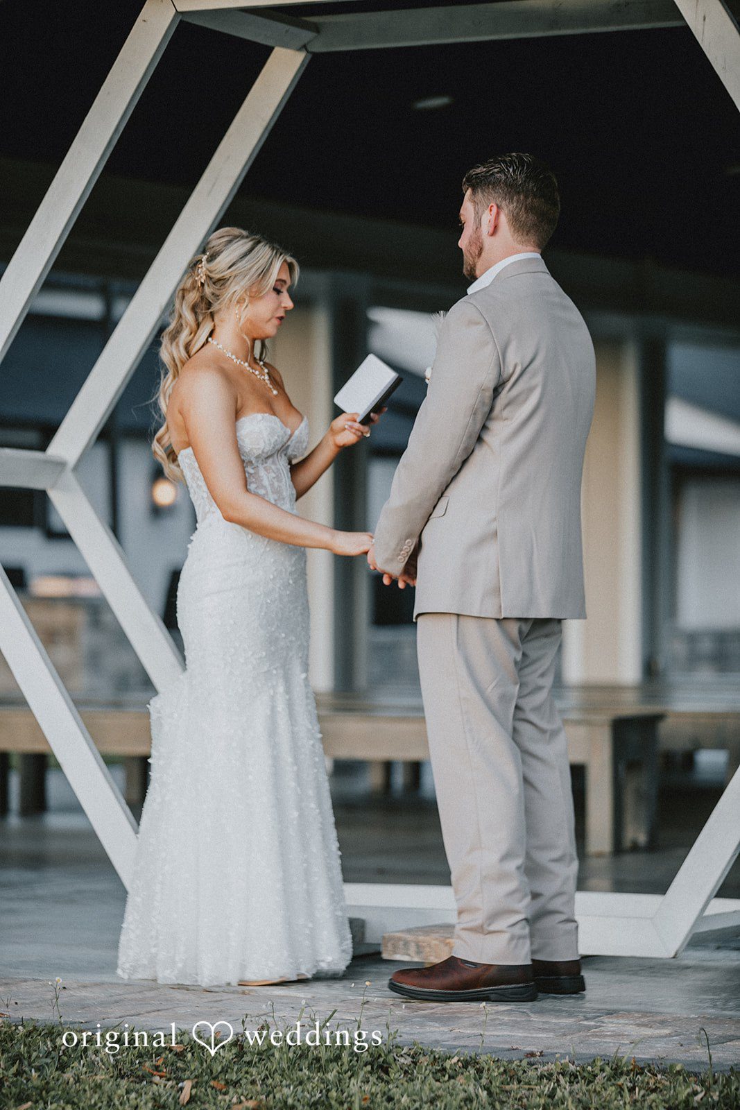 Catalyna + Nik Bride and groom reading their wedding vows to each other