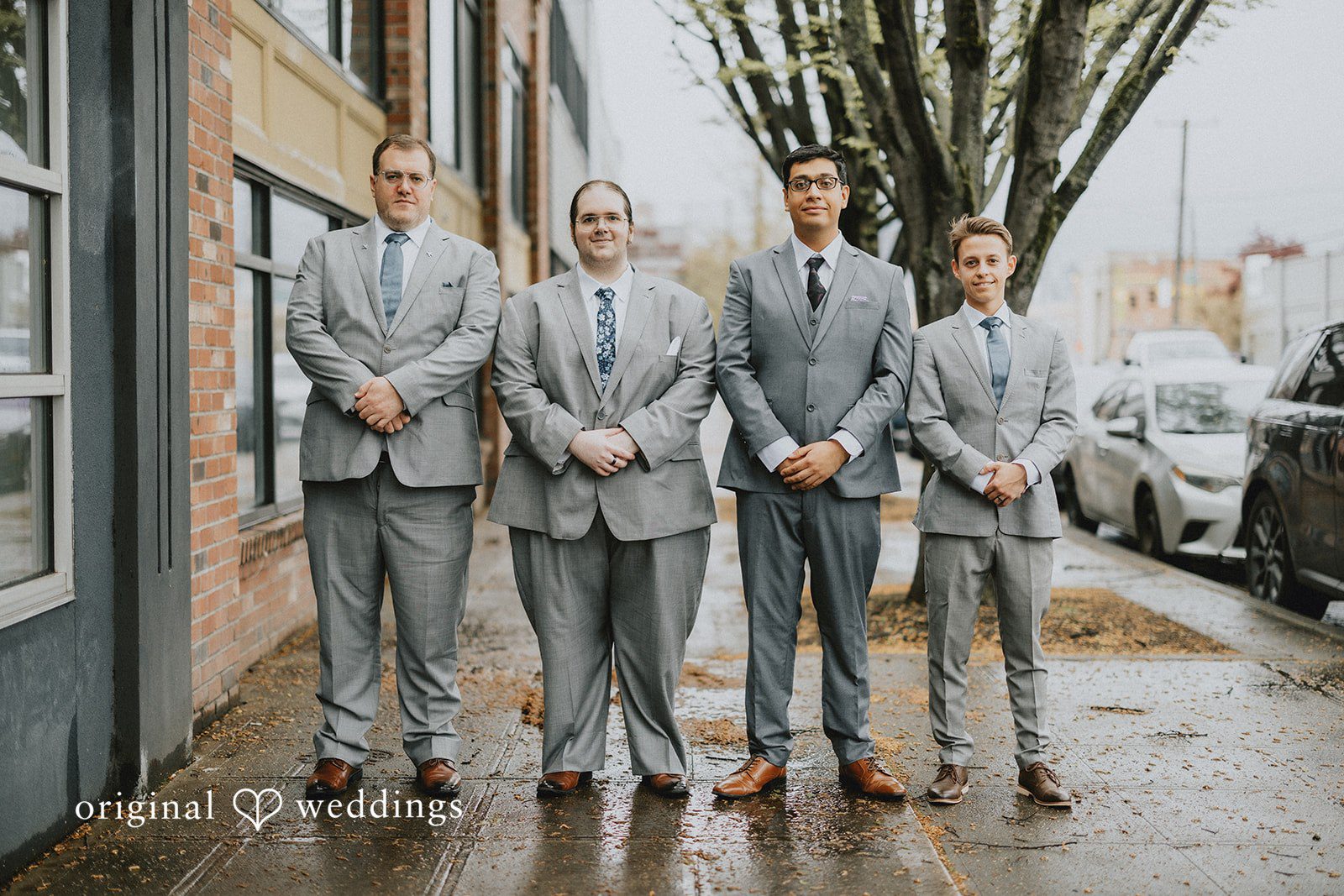 Stefani + Andrew Groom with groomsmen posing together before wedding ceremony at Ederer Hall