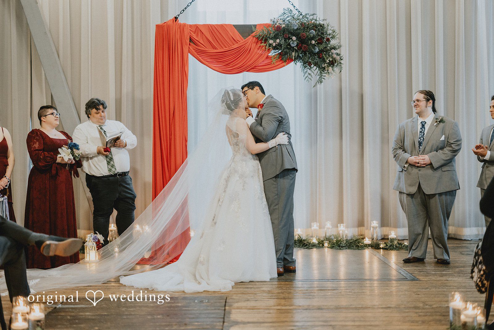 Stefani + Andrew Romantic first kiss during wedding ceremony at Ederer Hall