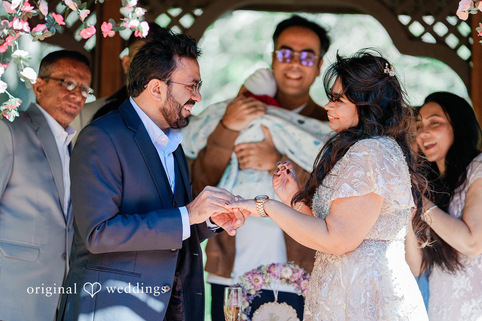 Couple exchanging rings during ceremony at Elliston Vineyards