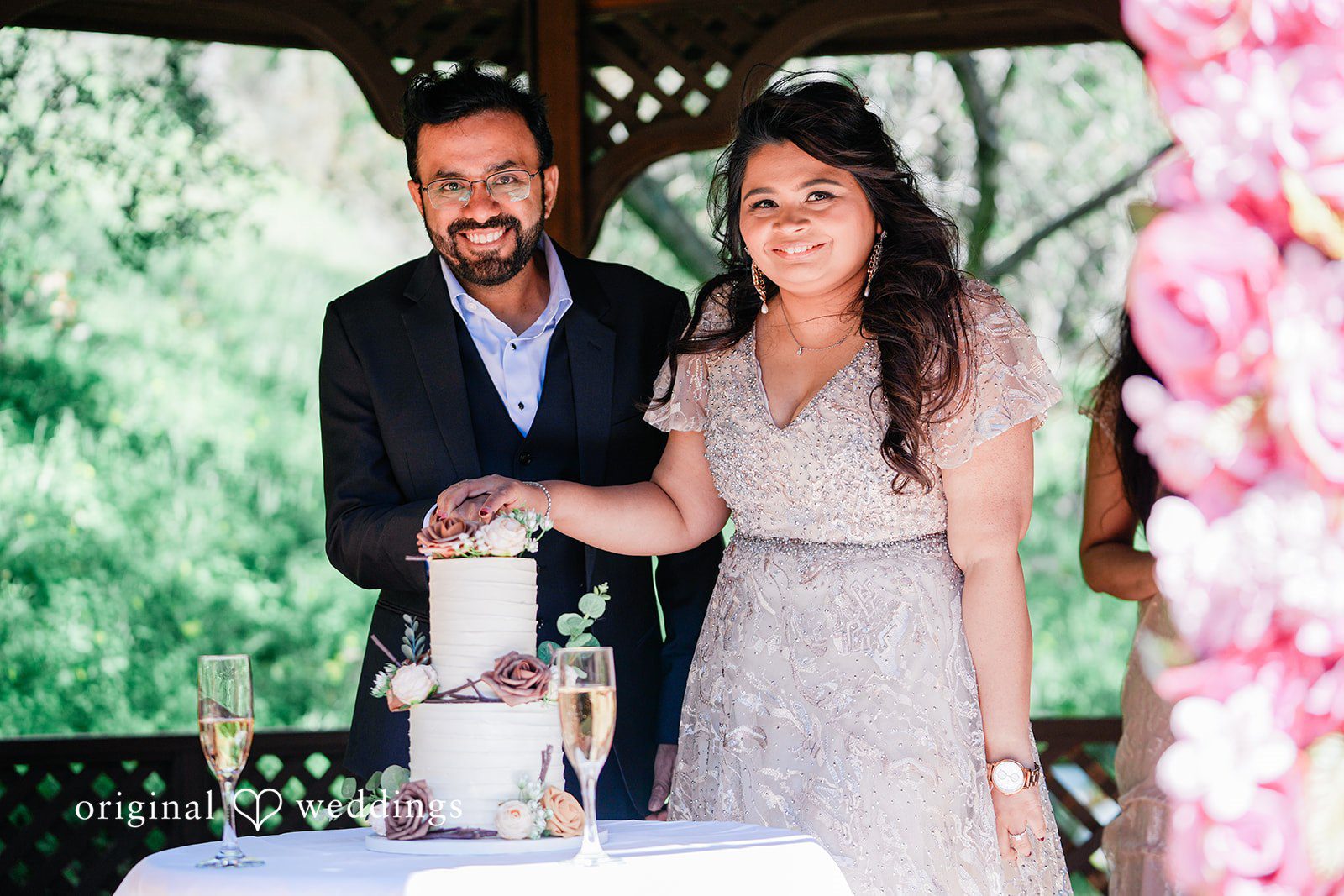 Beautiful couple cutting wedding cake