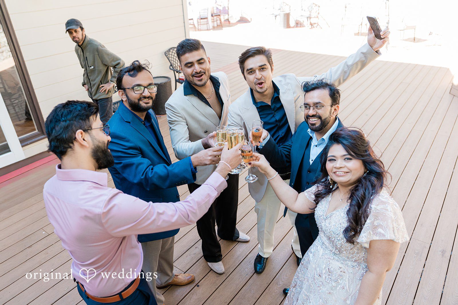 San Francisco wedding photography at Elliston Vineyards by original weddings capturing the joy of groom and bride with guests