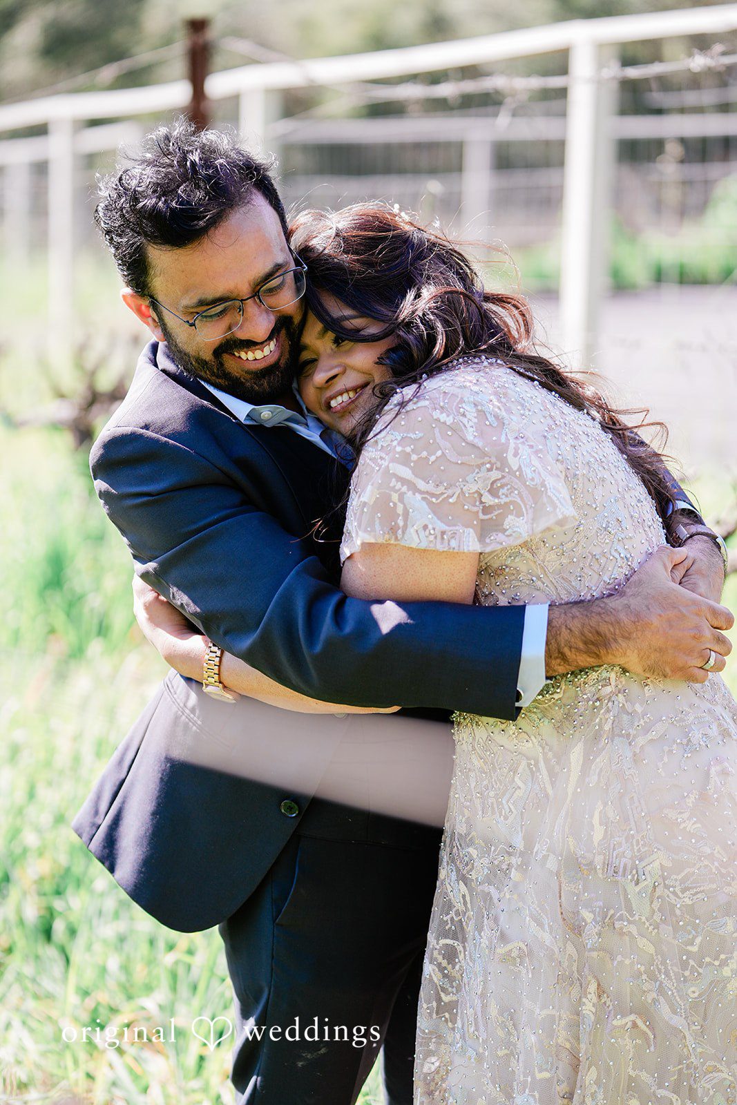 A candid hug of bride and groom at Elliston Vineyards