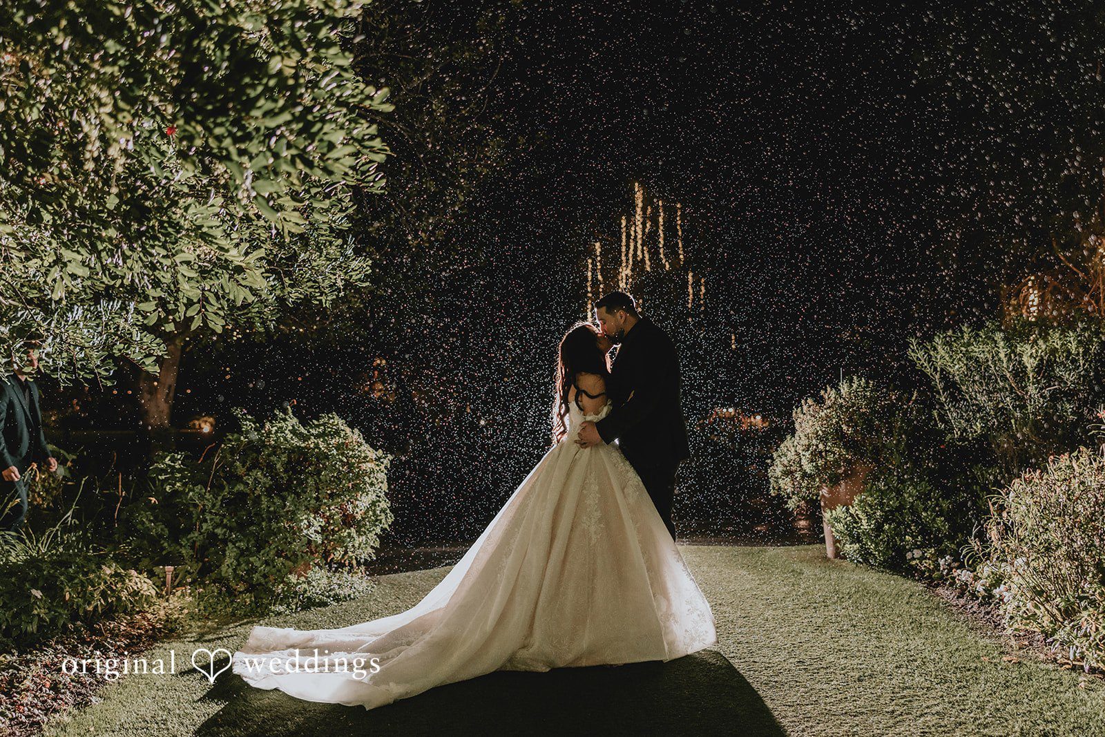Romantic kiss moment of couple at Ethereal Gardens
