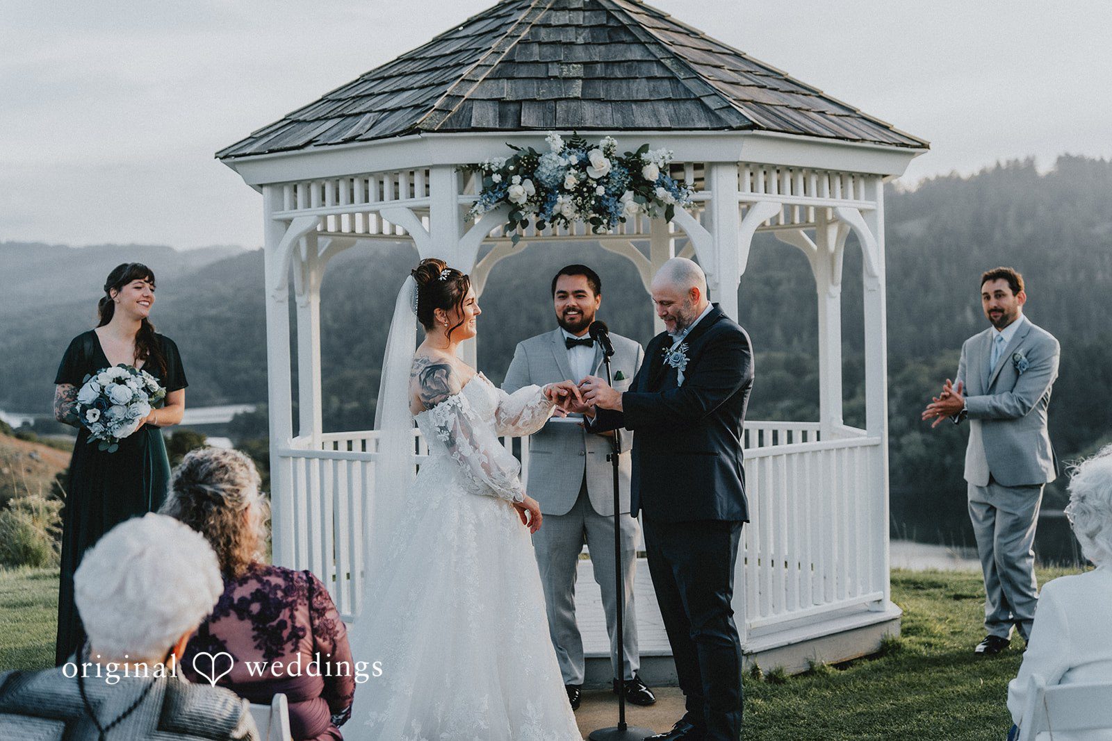 Dominique + Chris Bride and groom holding hands after exchanging vows