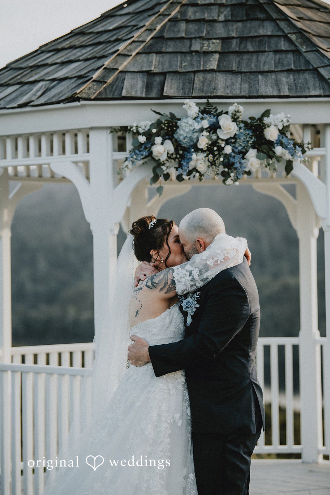 Dominique + Chris Newlyweds sharing their first embrace after the ceremony