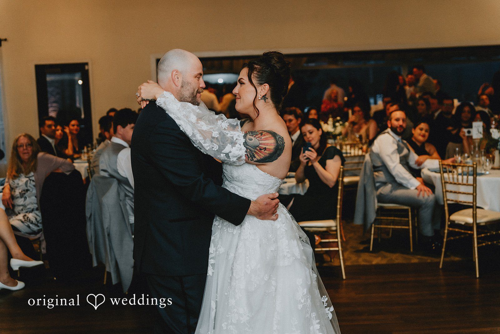 Dominique + Chris Couple sharing their first dance during the reception