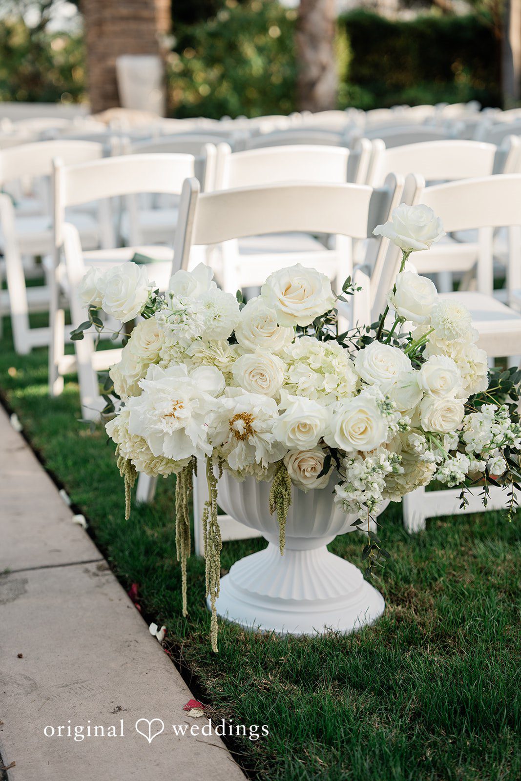 Jinelle + Brett Elegant white wedding flowers with romantic floral ceremony decor