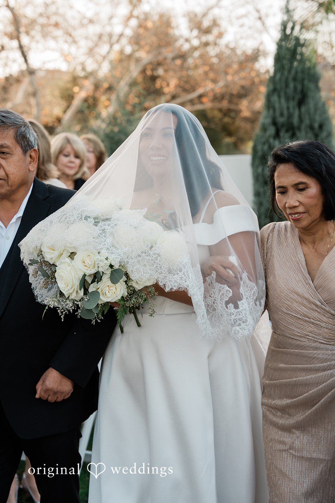 Jinelle + Brett Bride walking down the aisle