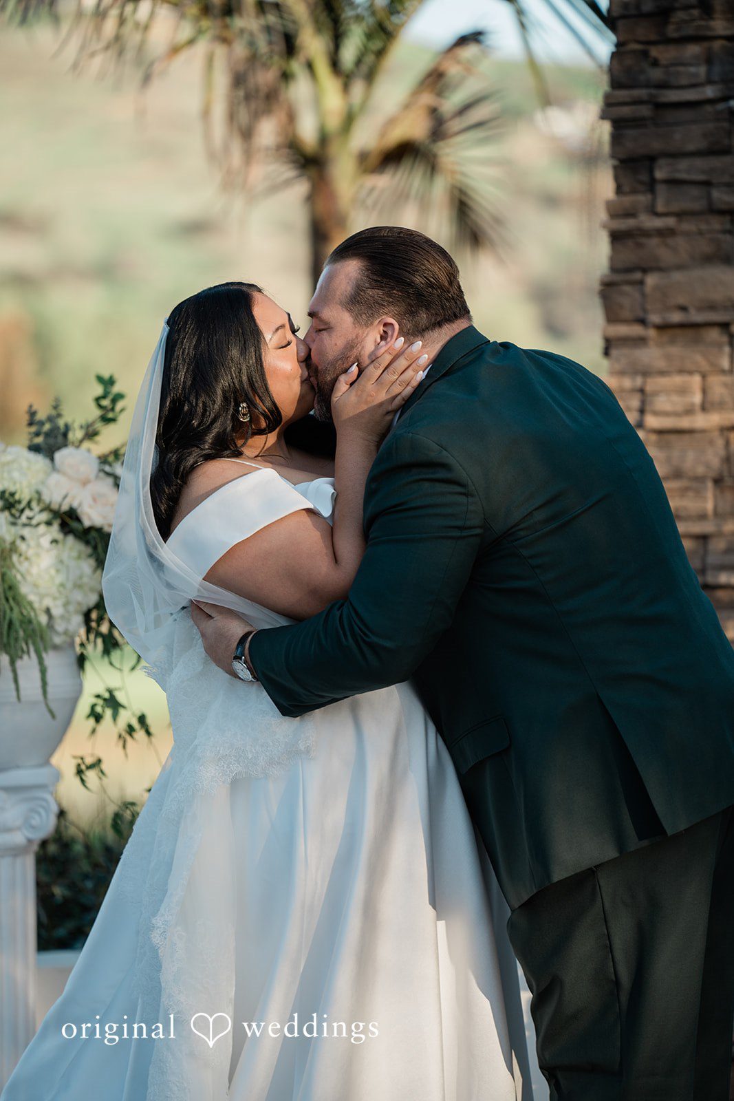 Jinelle + Brett Romantic moment of bride and groom kissing after wedding ceremony at Fallbrook Estate