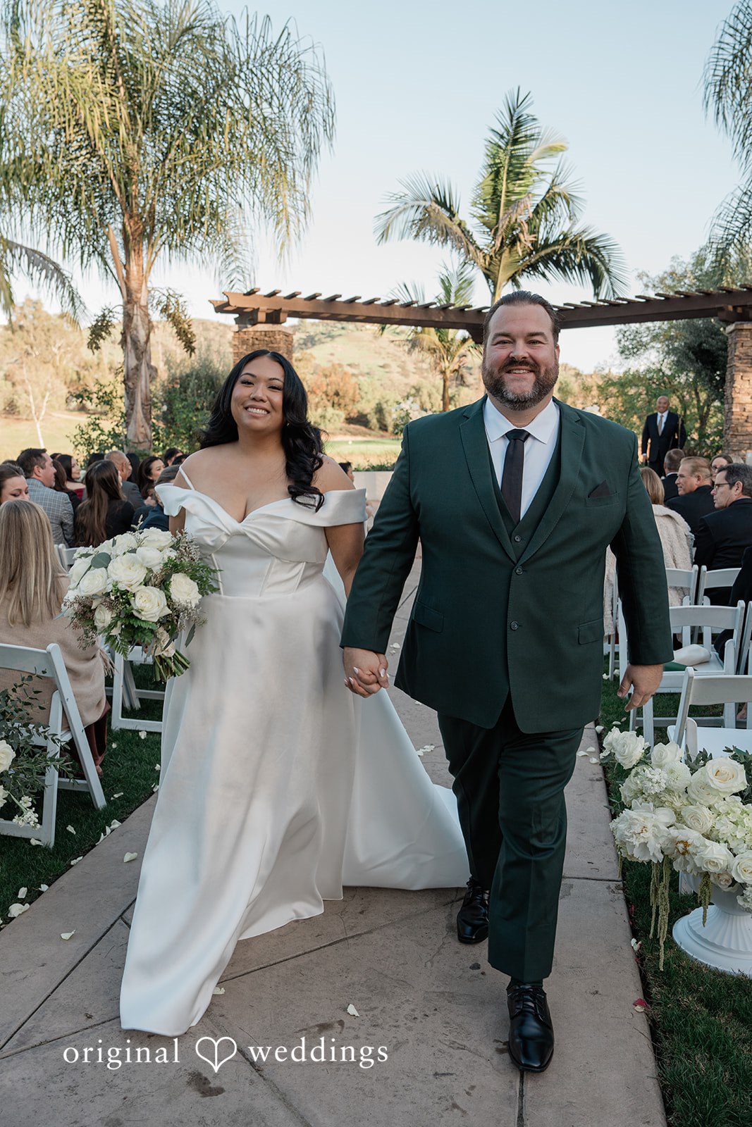 Jinelle + Brett Bride and groom walking together after wedding ceremony at Fallbrook Estate