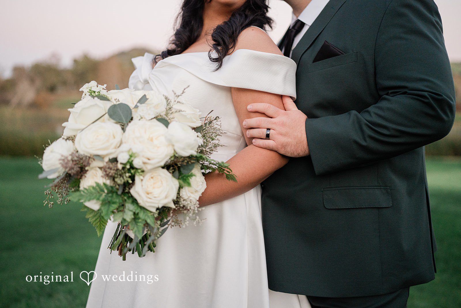 Jinelle + Brett Close up picture of bride and groom with elegant white rose bouquet