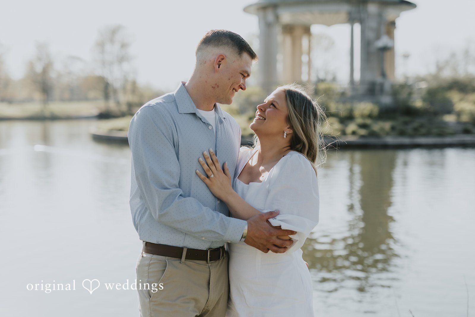 Our St. Louis wedding photographers at Original Weddings captured a romantic portrait of the couple by the waterfront at Forest Park