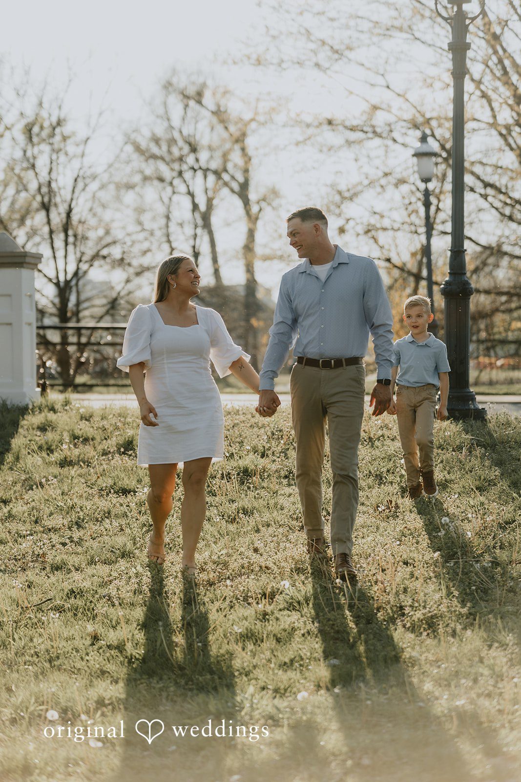 The couple takes a walk through the field