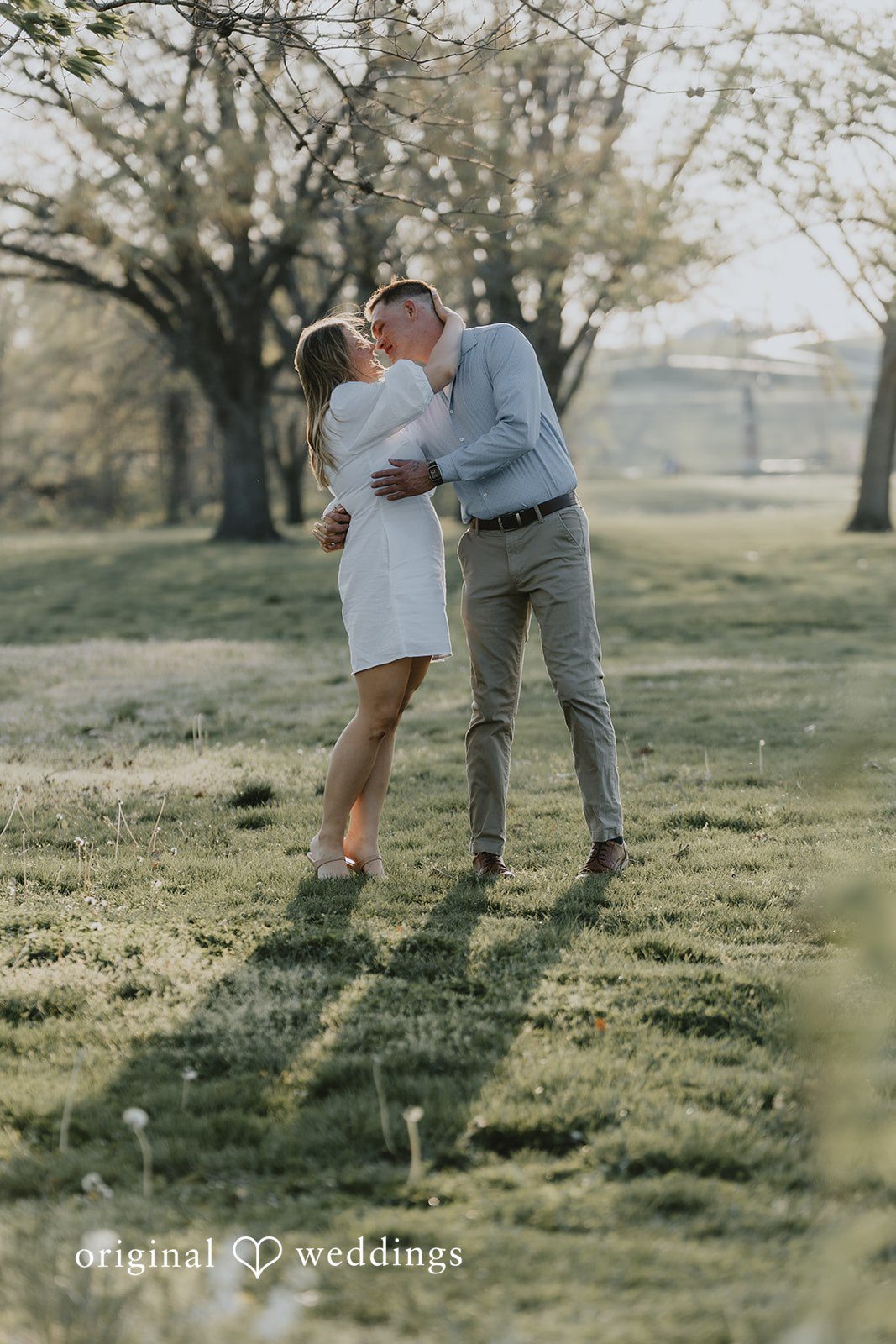 A romantic portrait of the couple at the field