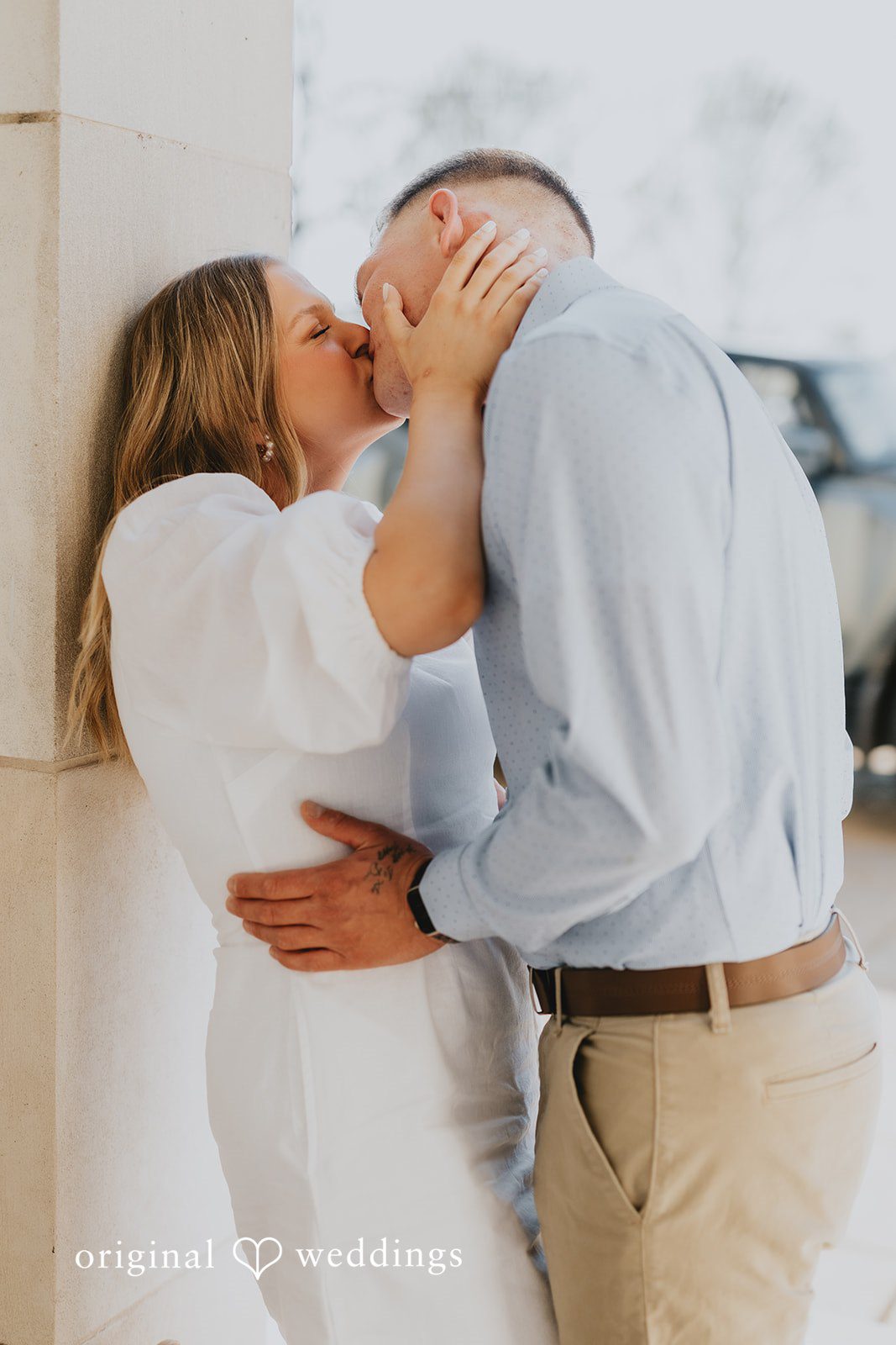 The couple shares a kiss