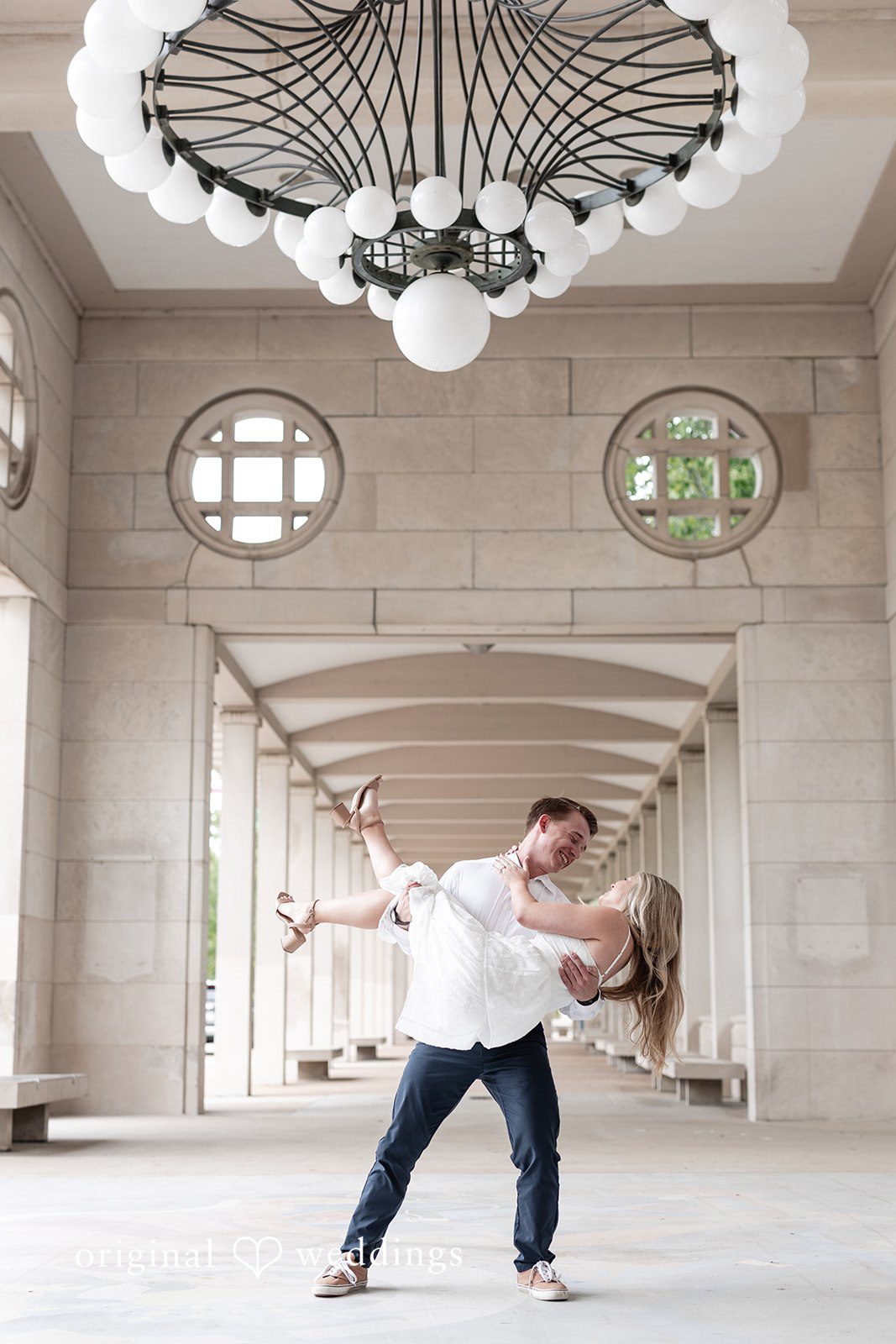 Rhyen + Jacob Groom holding the bride during engagement portraits