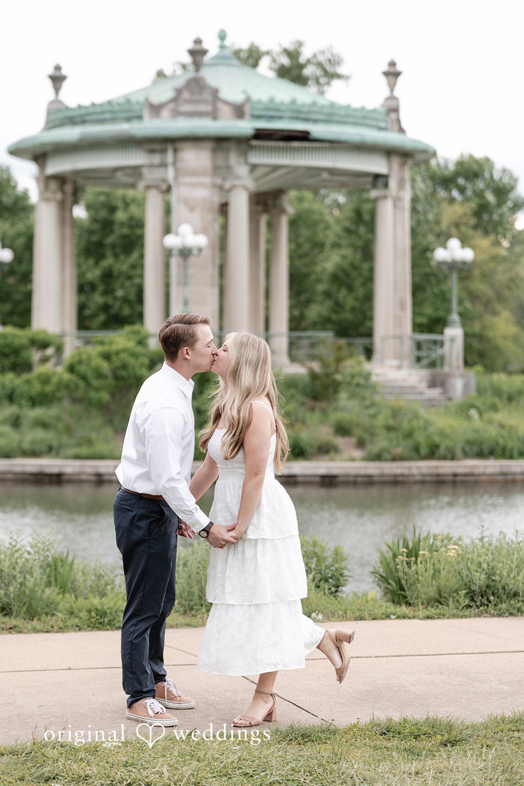 Rhyen + Jacob Couple holding hands and kissing during engagement photos