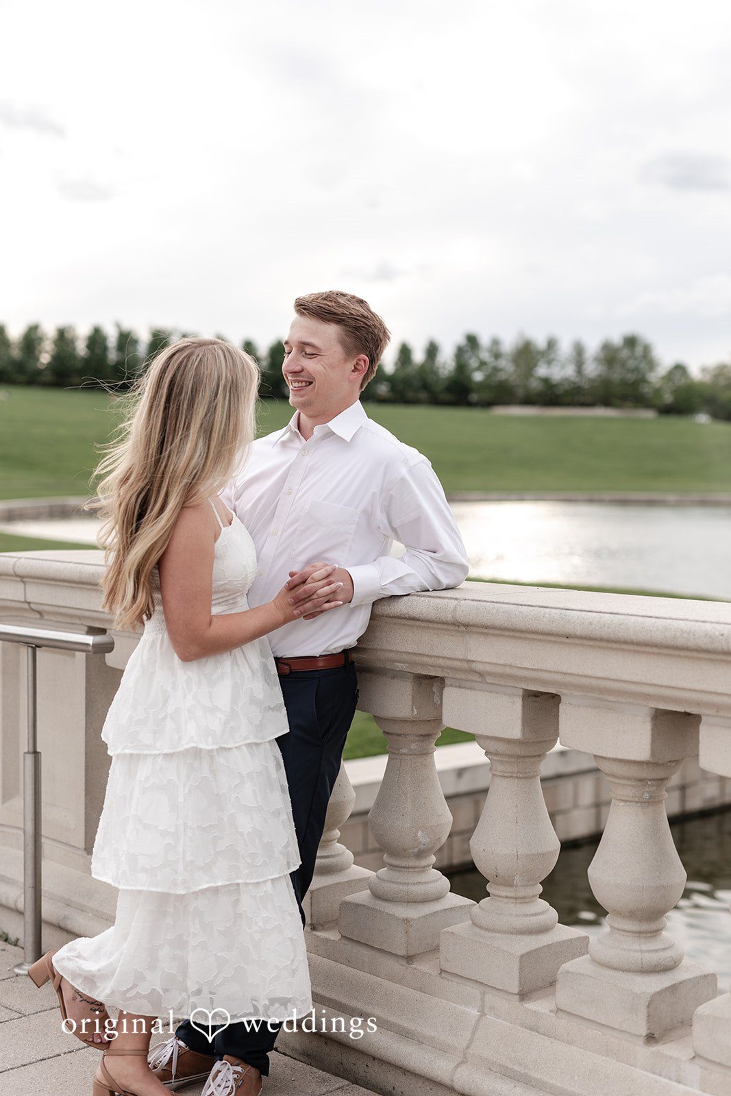 Rhyen + Jacob Bride posing with her back turned on the bridge during sunset