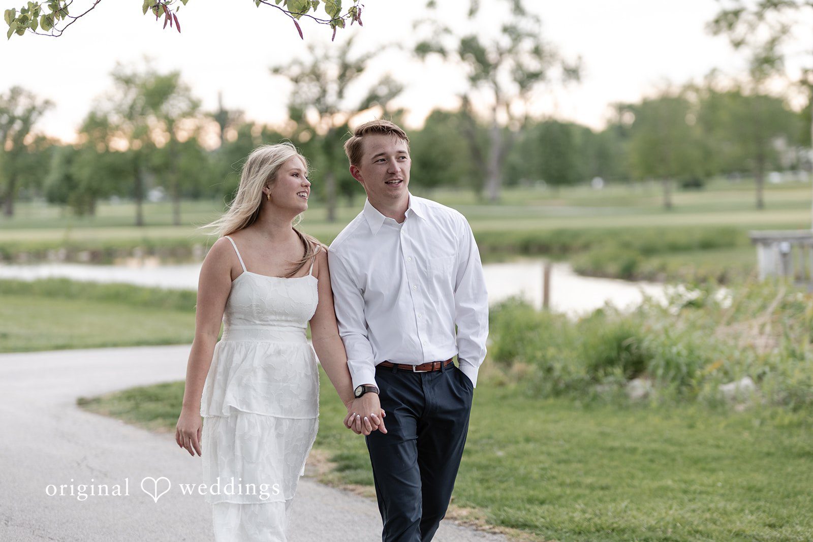 Rhyen + Jacob Couple walking together during sunset engagement portraits