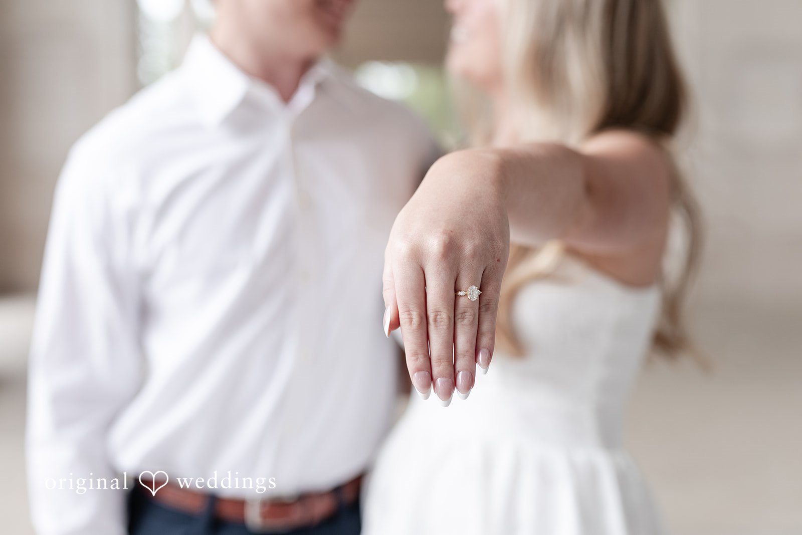 Rhyen + Jacob Bride showing her engagement ring during the outdoor session