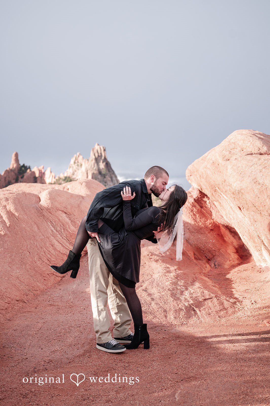 A romantic portrait of the by the red rocks at Garden of the Gods