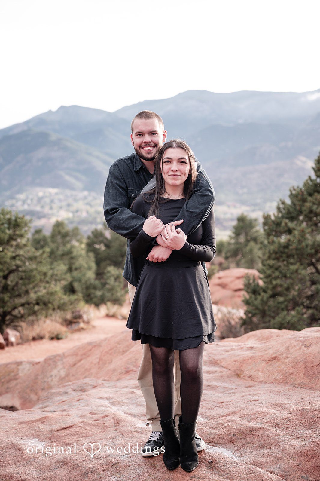 The groom holds his bride-to-be passionately
