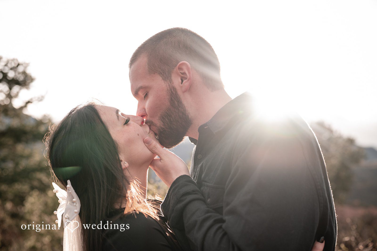 The couple shares a kiss