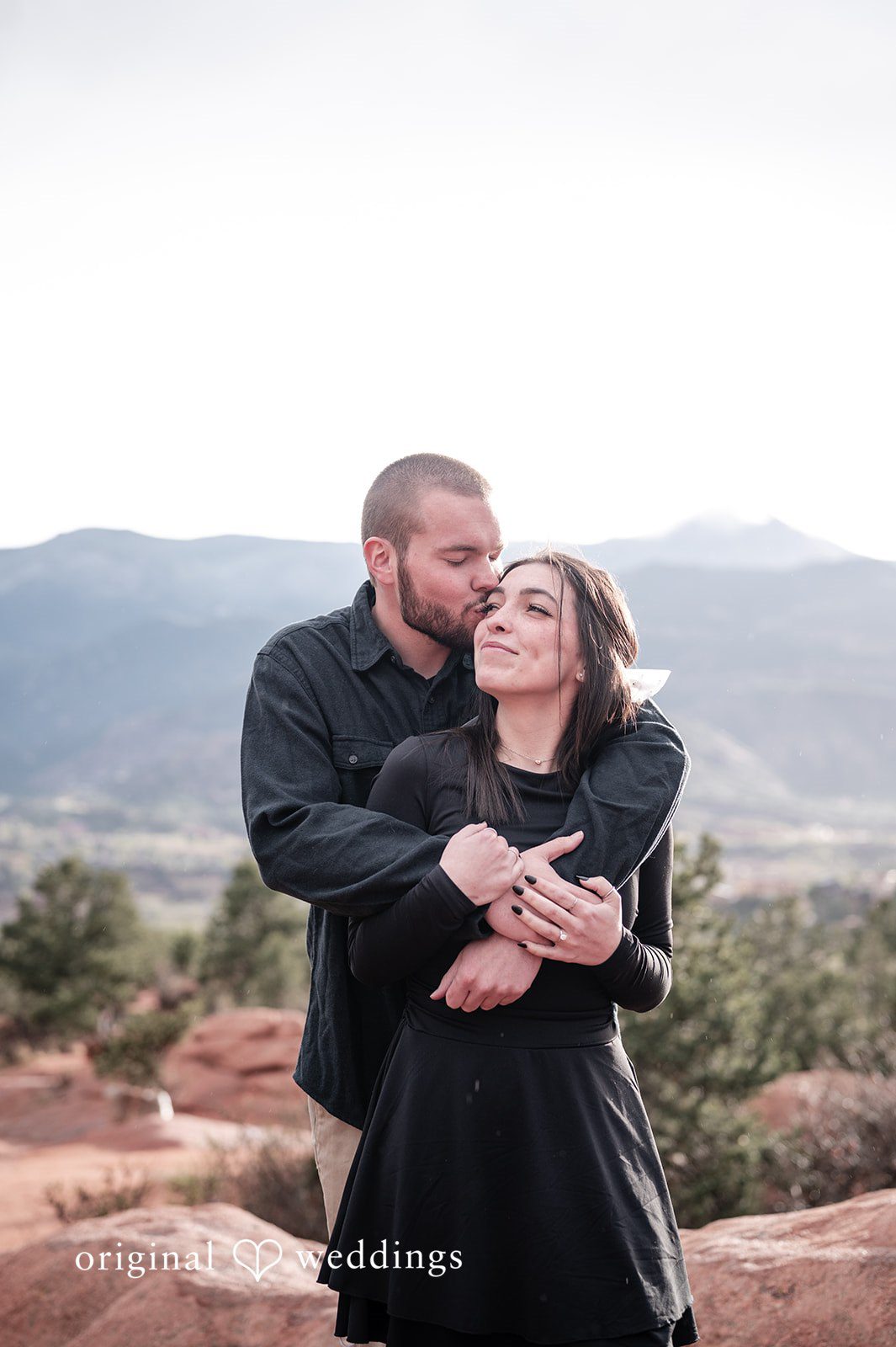 The groom pecks the bride at Garden of the Gods