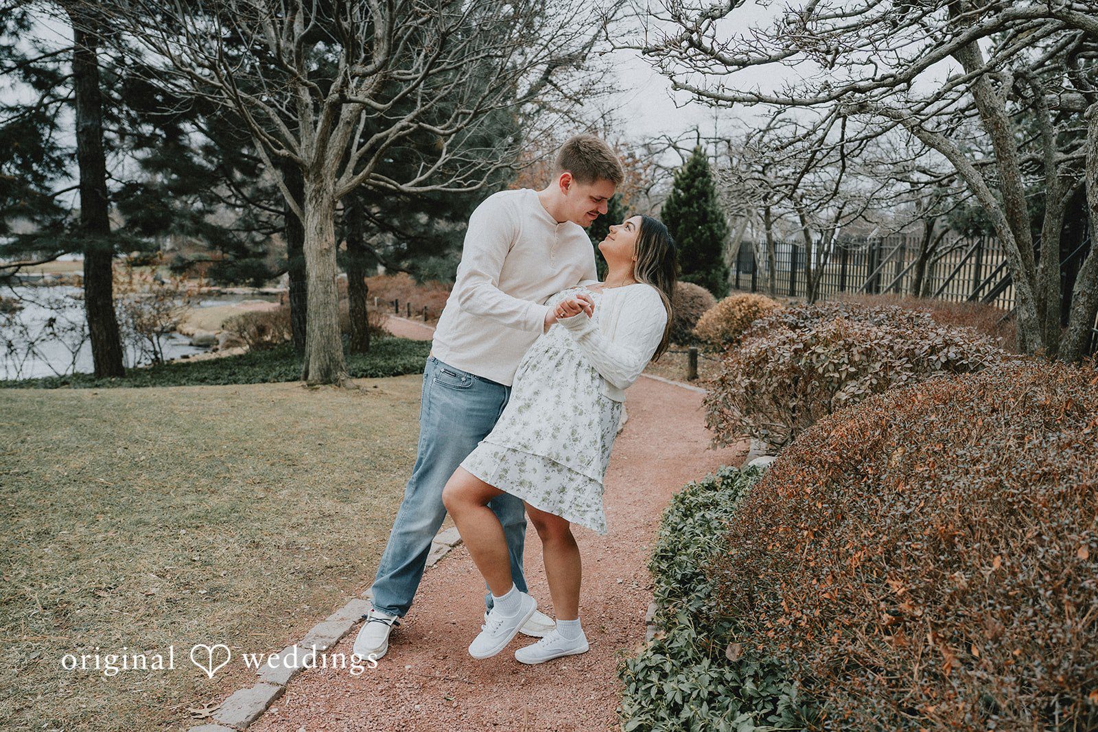 Couple sharing a close embrace while enjoying a relaxed romantic pose.