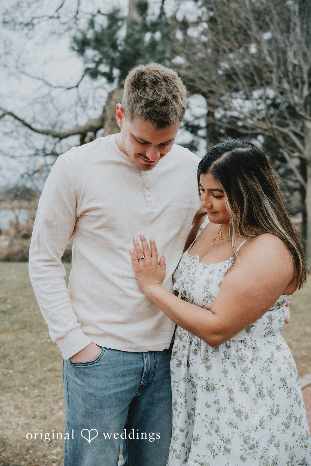 Couple sharing a close embrace while enjoying a relaxed romantic pose.