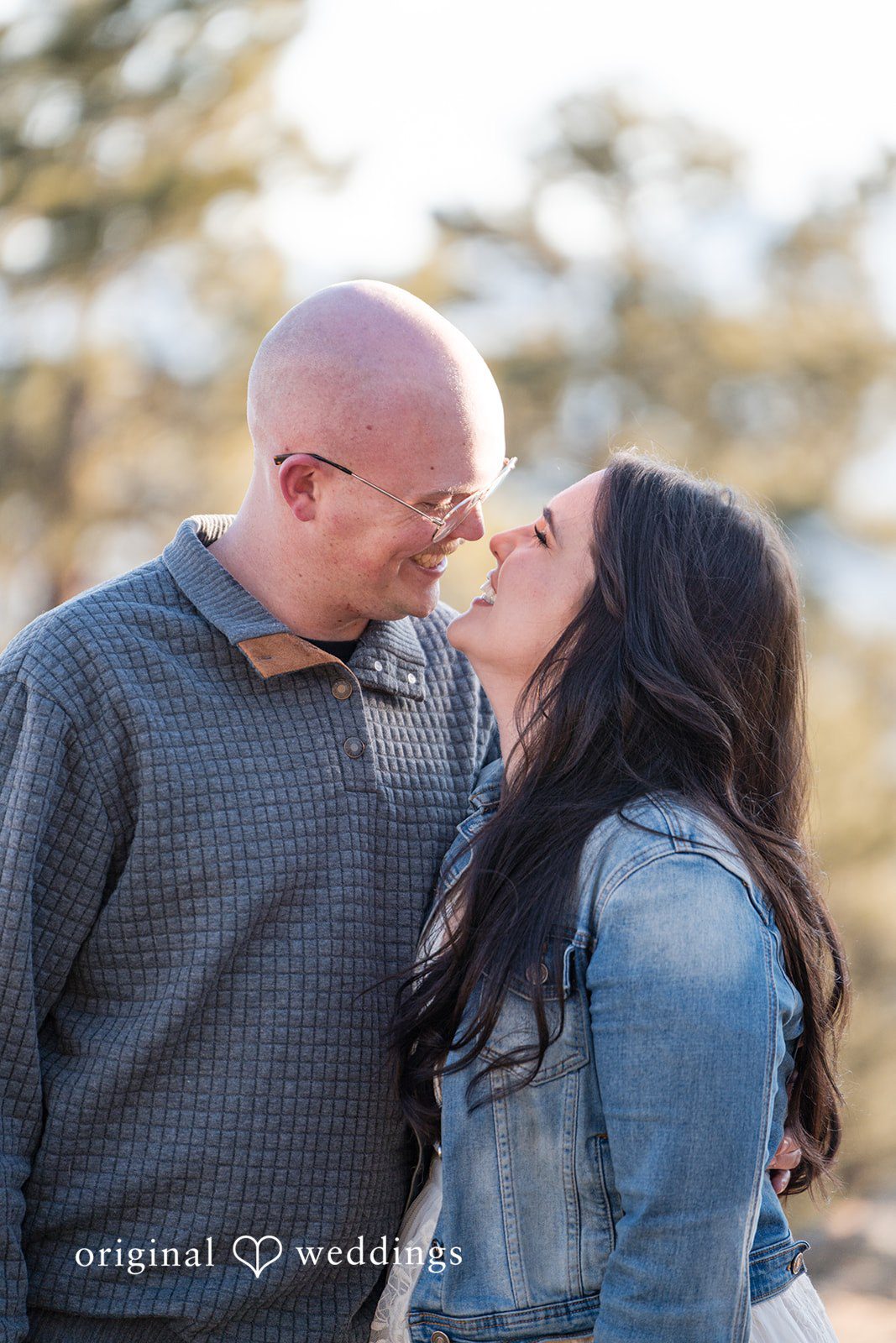 Lovely picture of couple smiling during photo session in Genesee Park