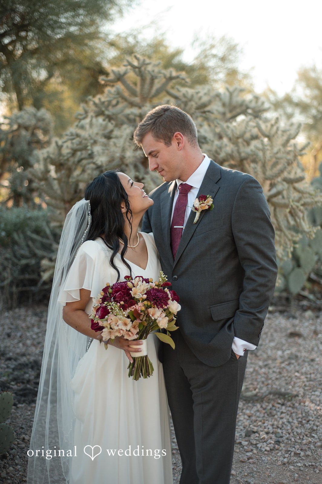 Romantic outdoor portrait of the couple looking at each other