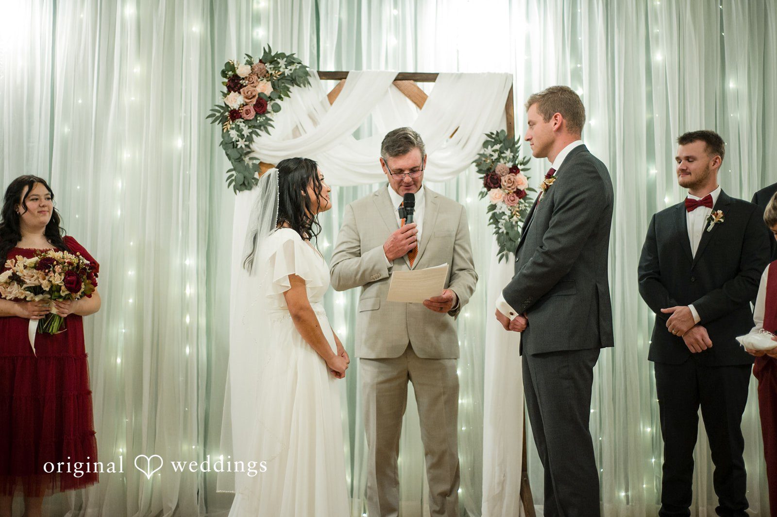 Bride and groom listening during the wedding ceremony vows