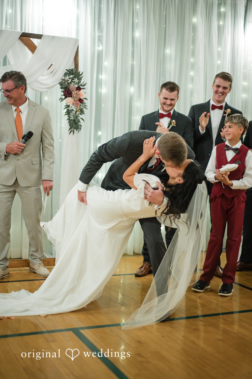 Couple sharing their first kiss after exchanging vows