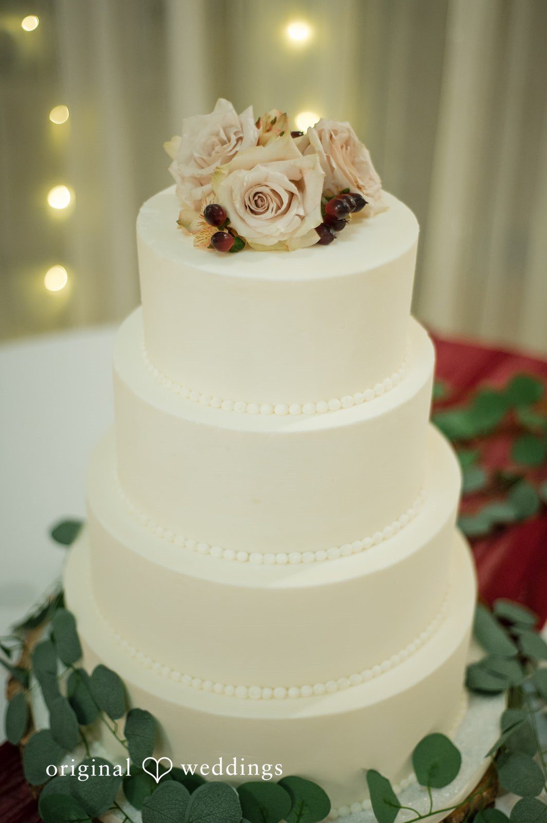 Elegant wedding cake with simple floral decorations