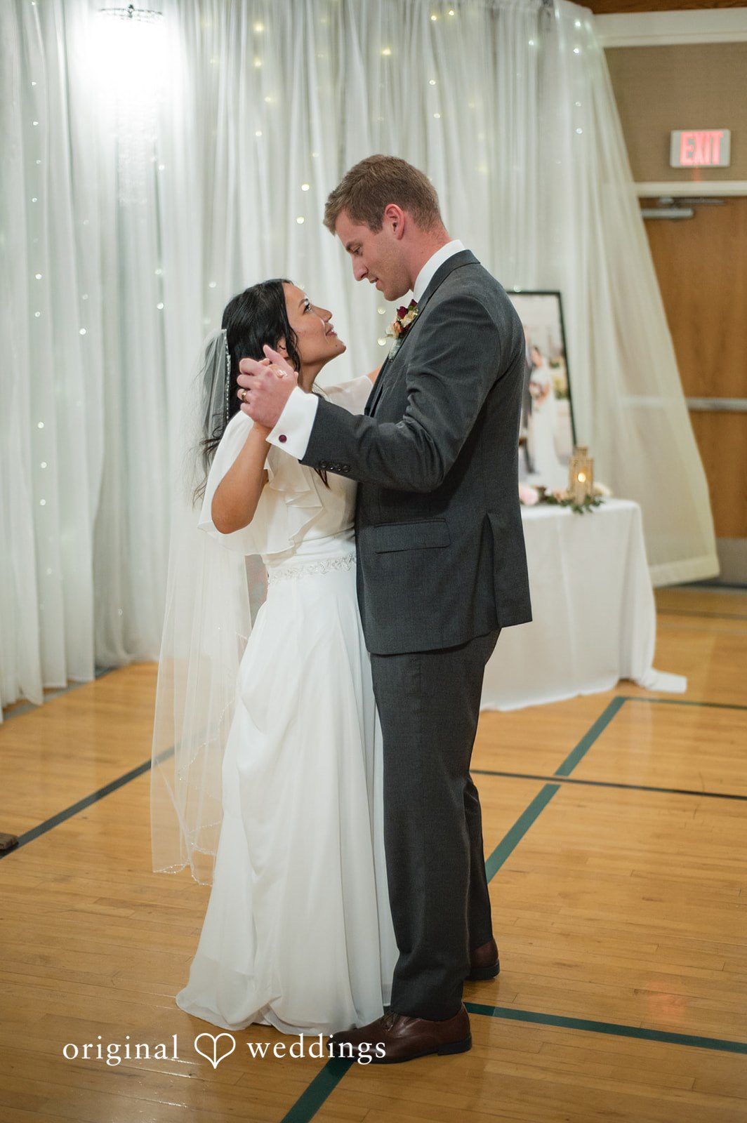 Bride and groom sharing their first dance at the reception