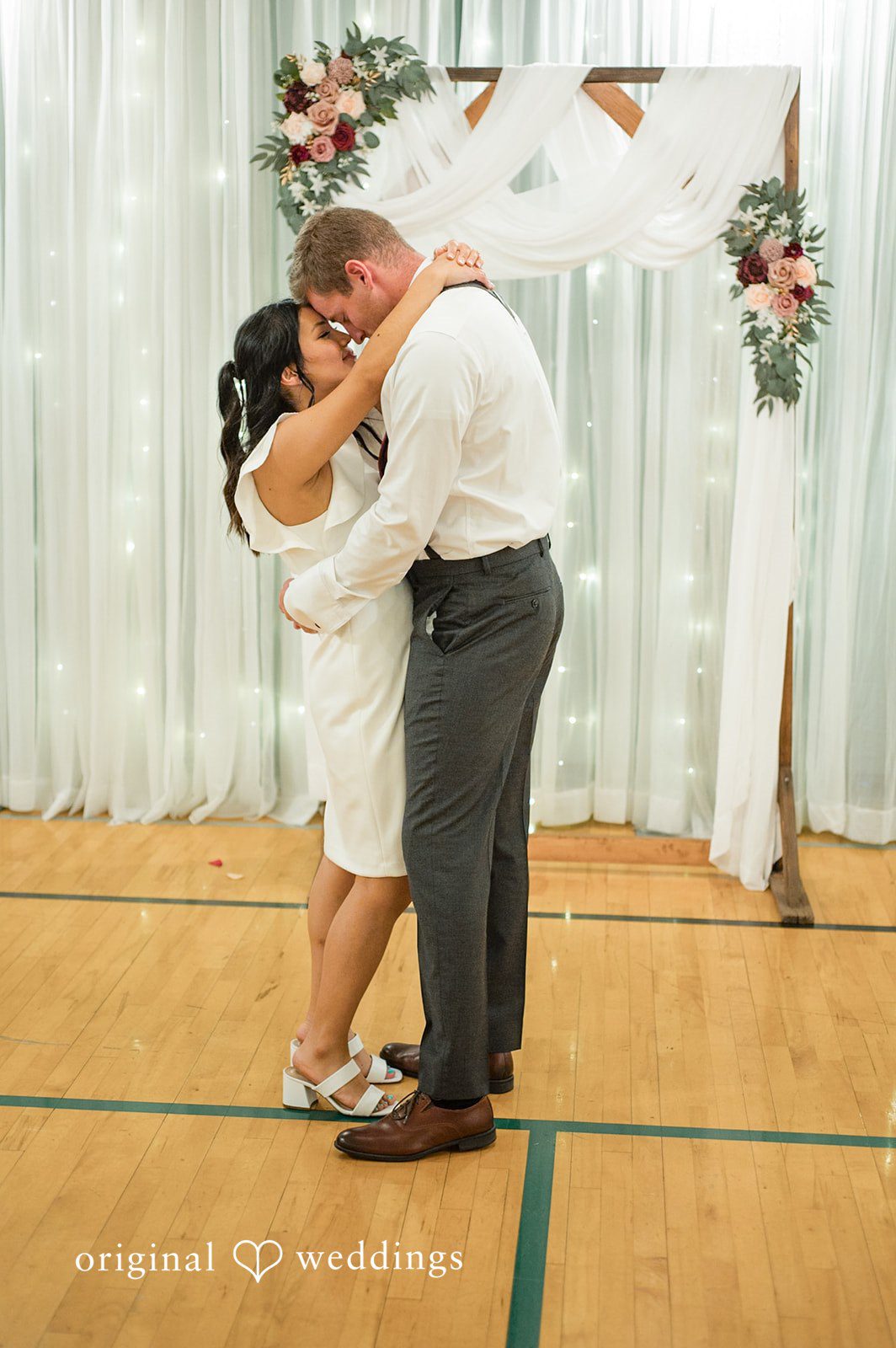 Elegant portrait of the bride and groom dancing together