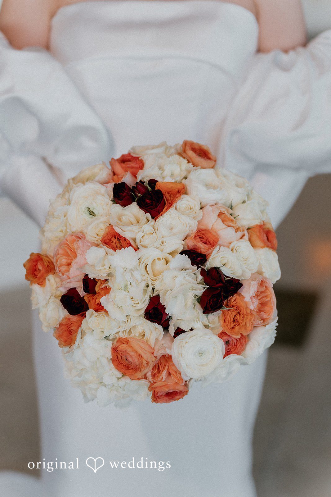 A close-up shot of the bride with her huge bouquet