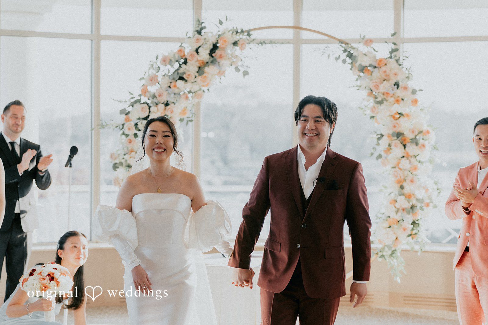 The couple exits the ceremony hall excitedly