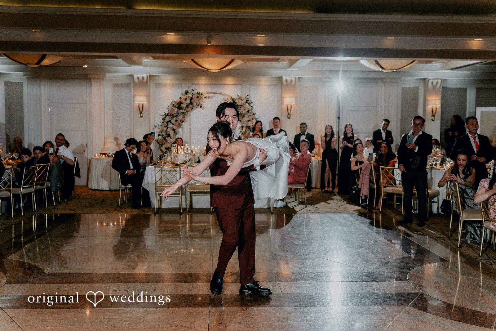 The couple having a fun time at their Glen Island Harbour Club wedding reception