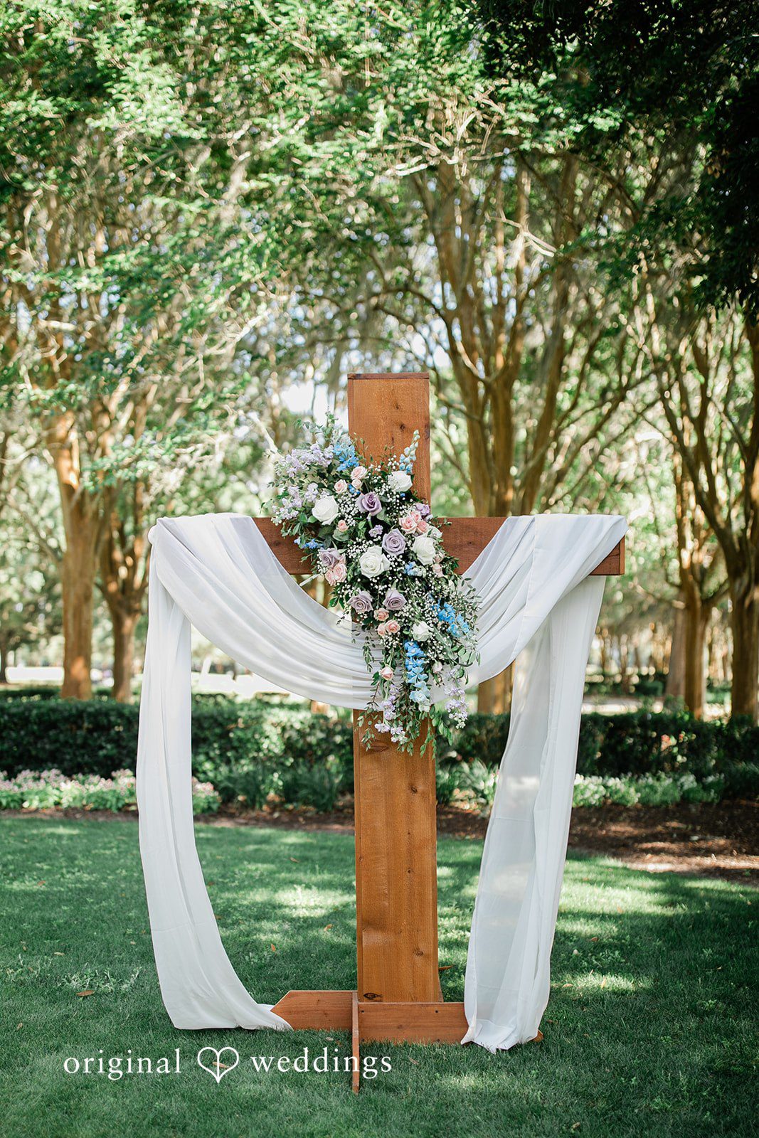 The ceremony arch adorned with lush florals