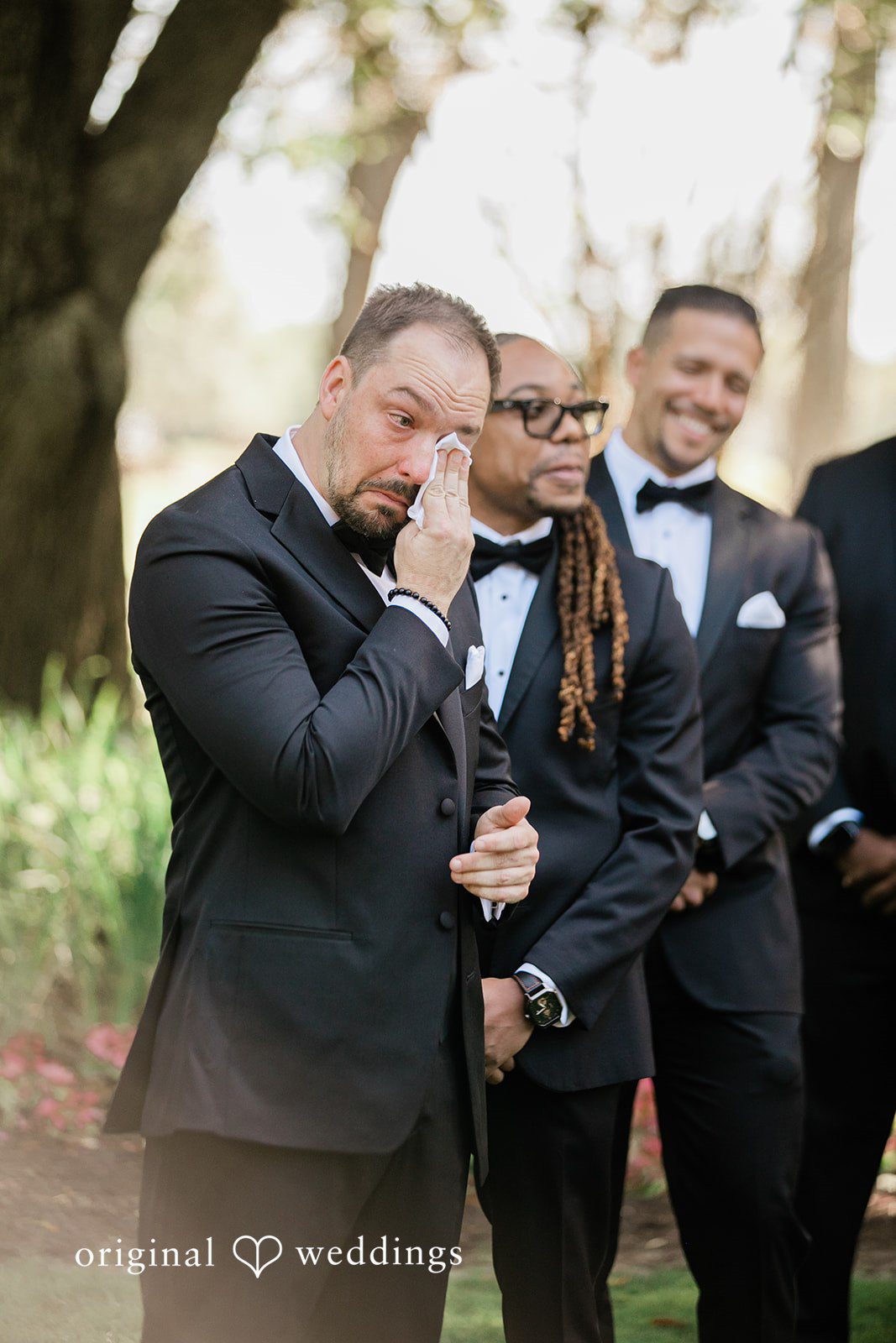The groom tears up seeing his bride