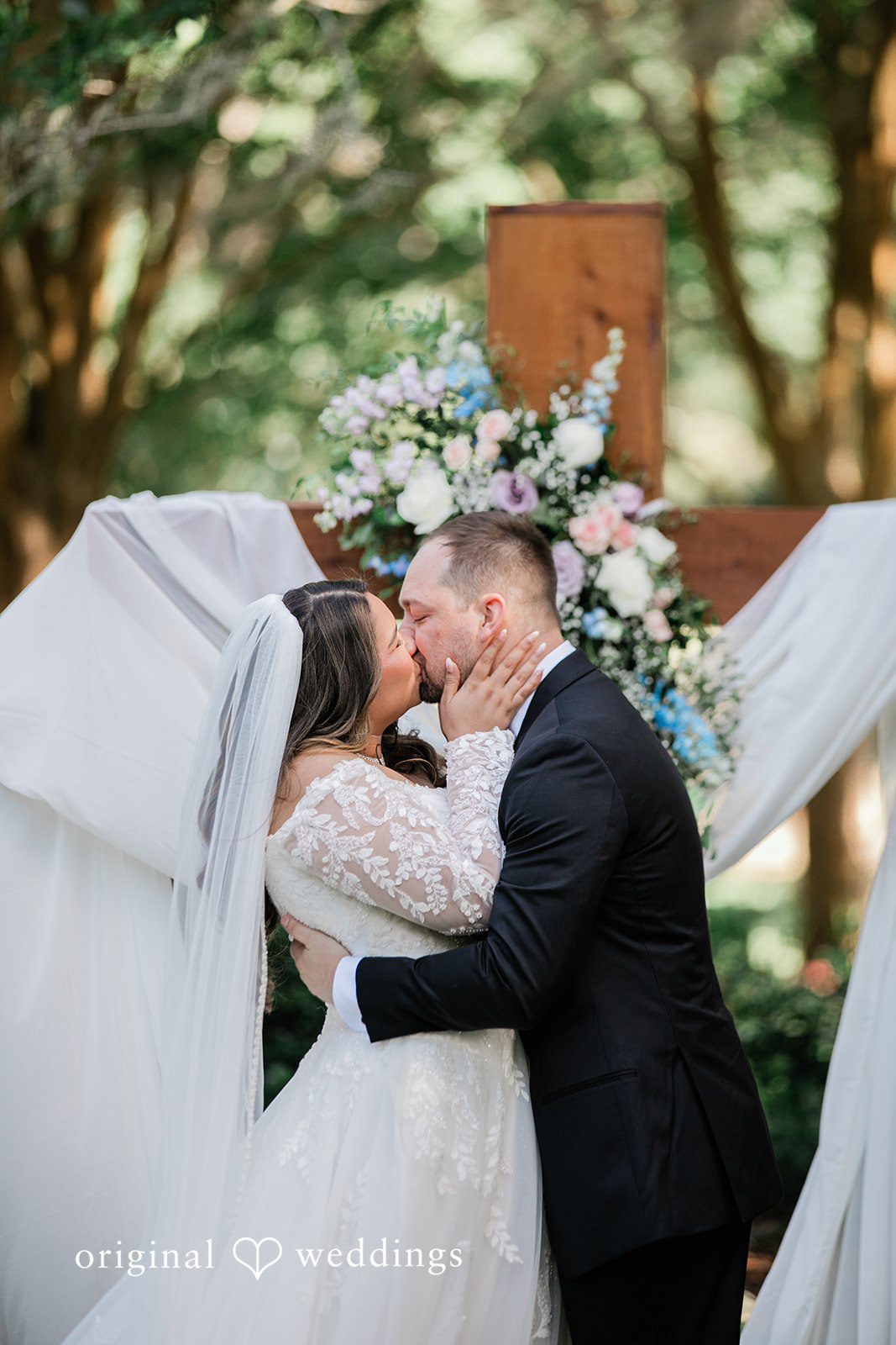 The couple shares a romantic kiss