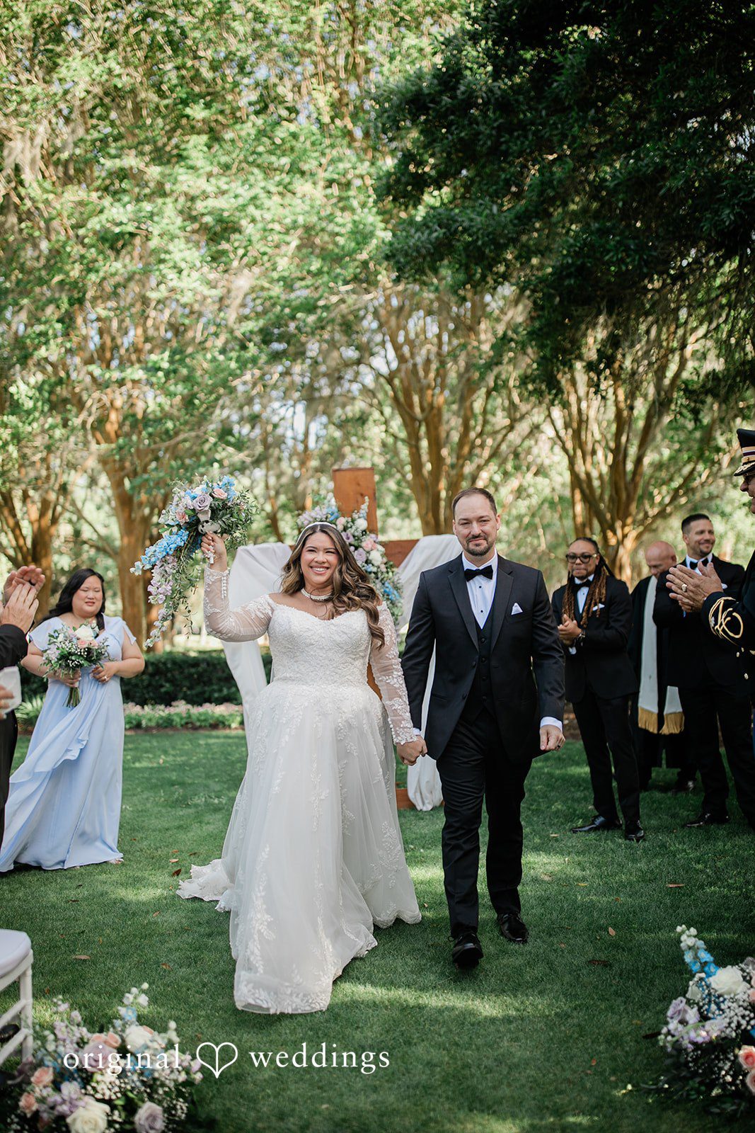 Our Orlando wedding photographers captured a joyful portrait of the couple after the exchange of marital vows