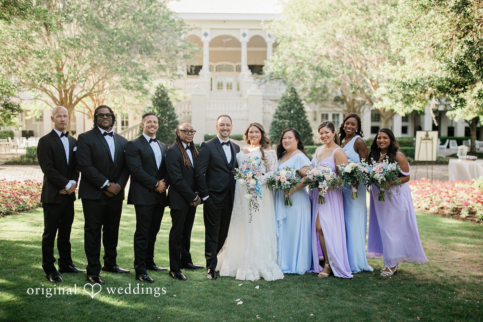 Our Orlando wedding photographers at Original Weddings captured a stunning portrait of the couple and their bridal party at Golden Ocala Golf & Equestrian Club