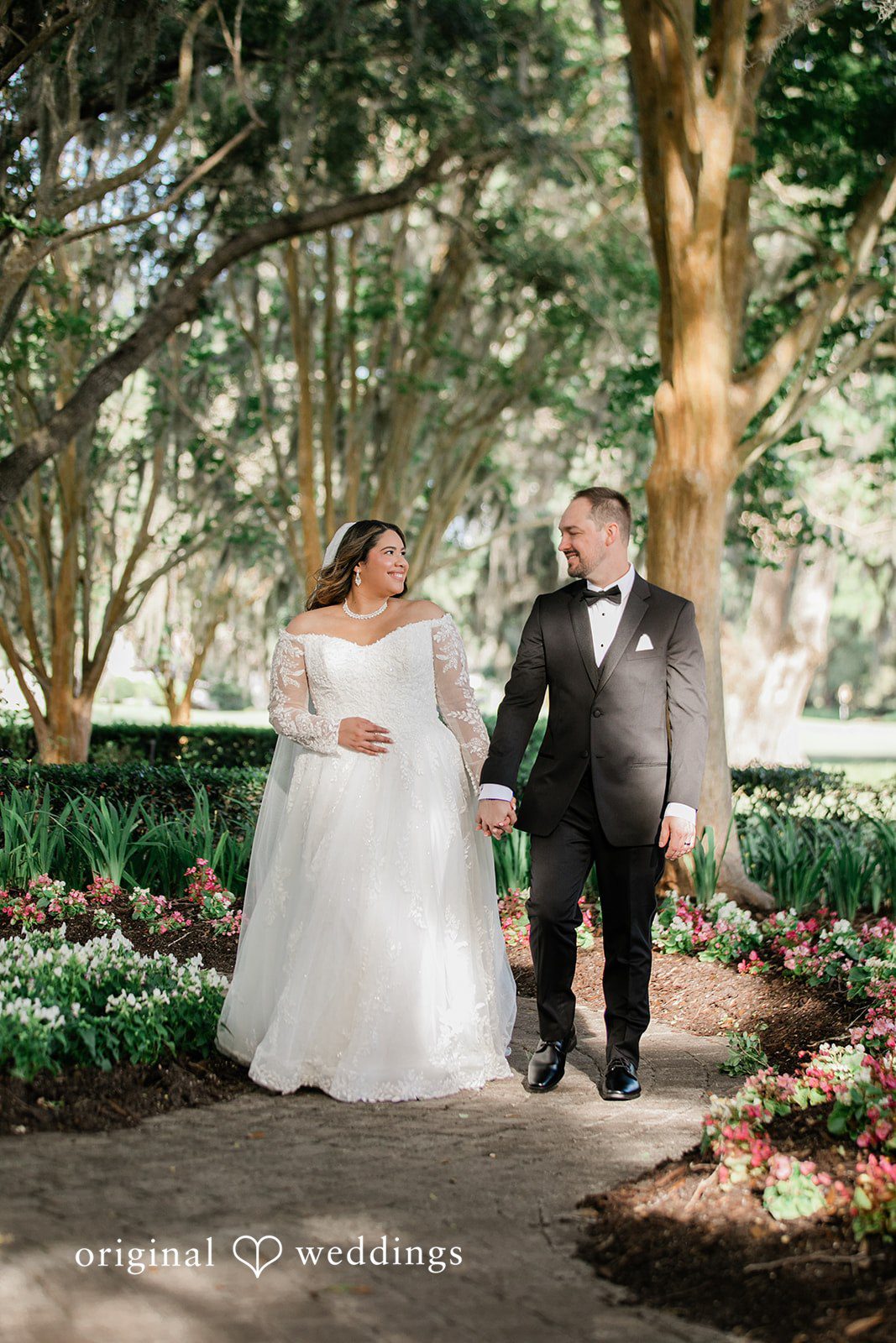 A portrait of the couple in the garden